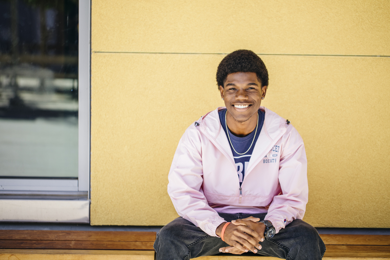Student sits on bench at UC Merced